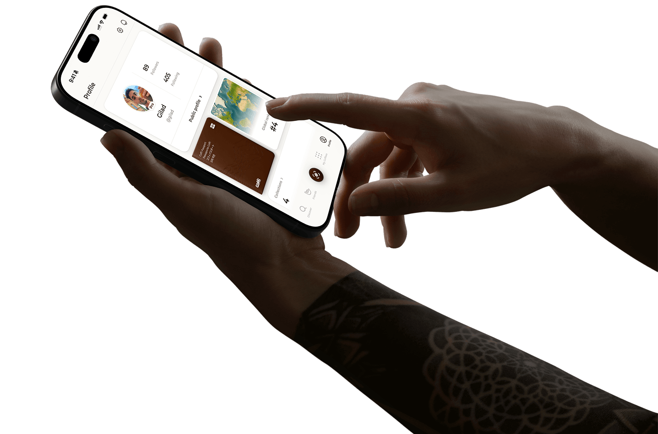 Hands holding iPhone showing Coffi app profile